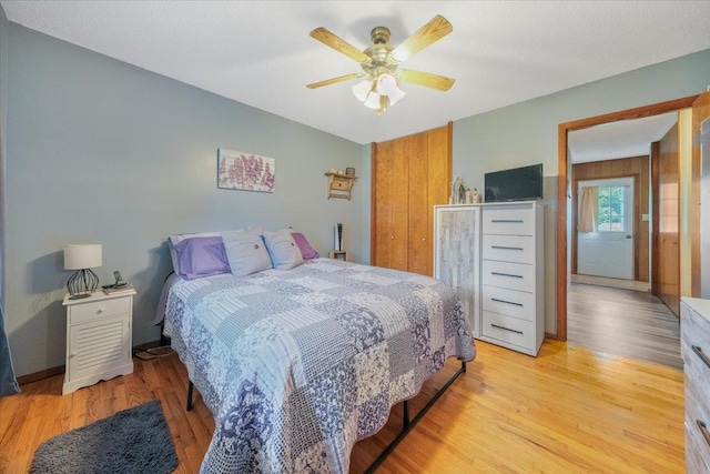 305 E Marshall St, Tolono, IL 61880 - bedroom featuring light wood-style floors and ceiling fan