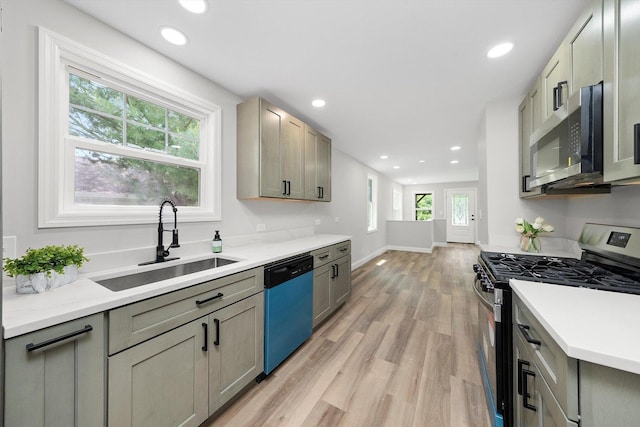 114 Maple St, Mchenry, IL 60051 - kitchen featuring appliances with stainless steel finishes, light wood-style floors, and recessed lighting