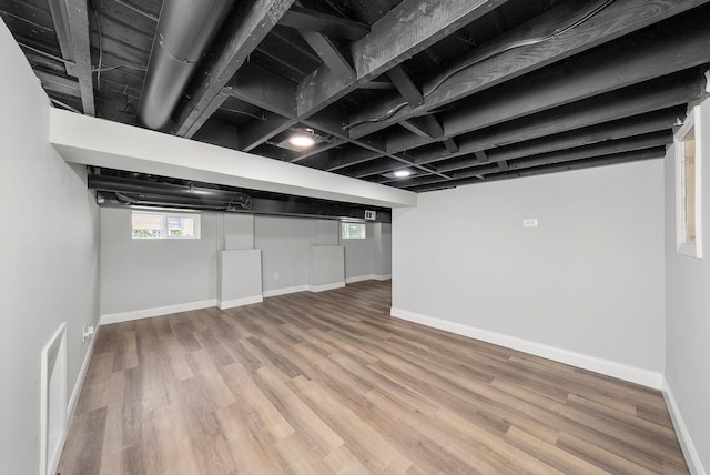 114 Maple St, Mchenry, IL 60051 - basement with wood finished floors and baseboards