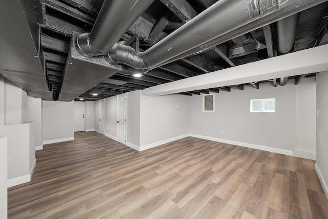 114 Maple St, Mchenry, IL 60051 - below grade area featuring electric panel and wood finished floors