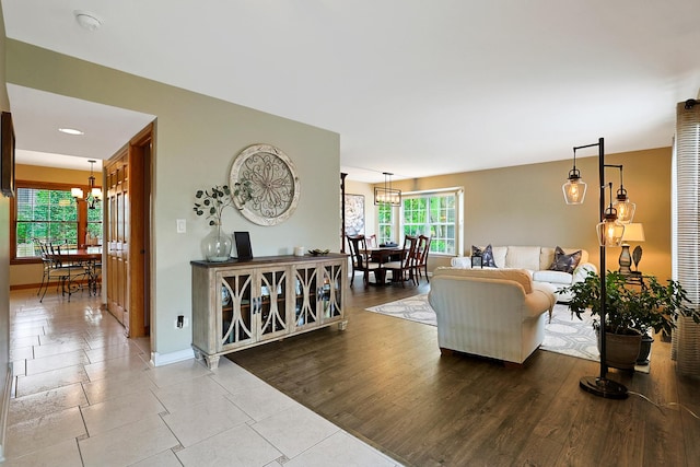 747 Warwick Ct, Carol Stream, IL 60188 - living area featuring a chandelier and baseboards