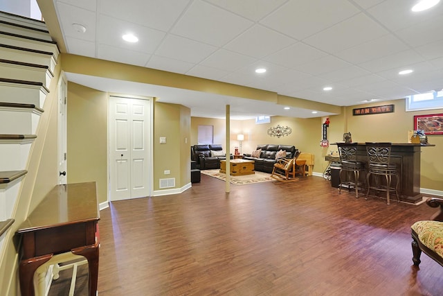 747 Warwick Ct, Carol Stream, IL 60188 - living room with a dry bar, wood finished floors, stairway, and a paneled ceiling