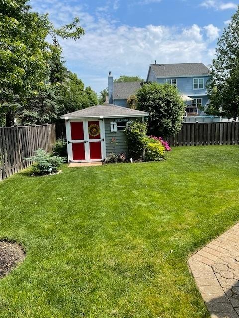 747 Warwick Ct, Carol Stream, IL 60188 - fenced backyard with a storage unit