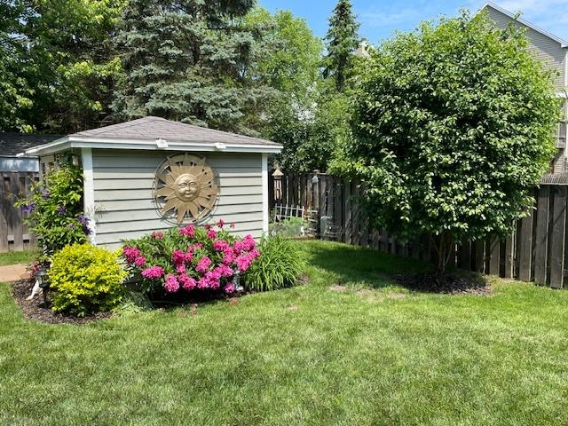 747 Warwick Ct, Carol Stream, IL 60188 - fenced backyard with a shed