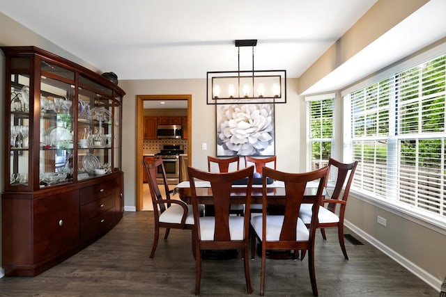 747 Warwick Ct, Carol Stream, IL 60188 - dining area with a chandelier and dark wood-type flooring