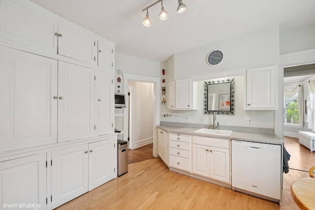 235 S Grove Ave, Oak Park, IL 60302 - kitchen with dishwasher, light wood finished floors, light countertops, and white cabinets