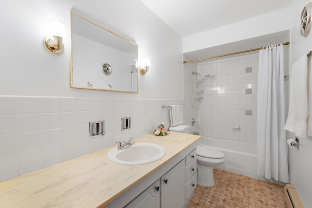 bathroom with a baseboard radiator, shower / bath combination with curtain, and vanity
