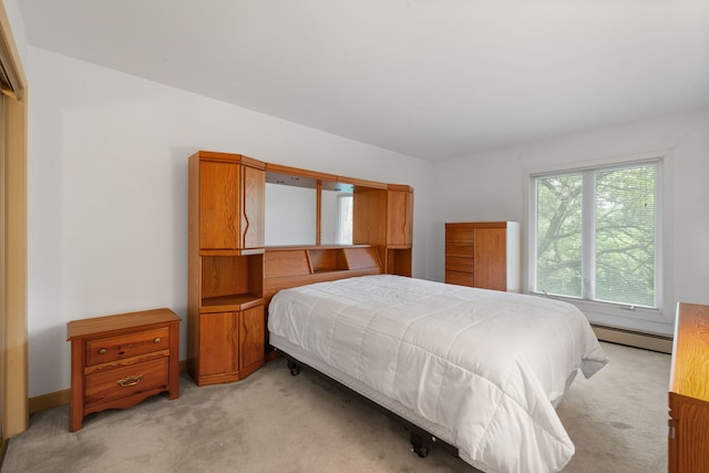 bedroom featuring light colored carpet and a baseboard radiator