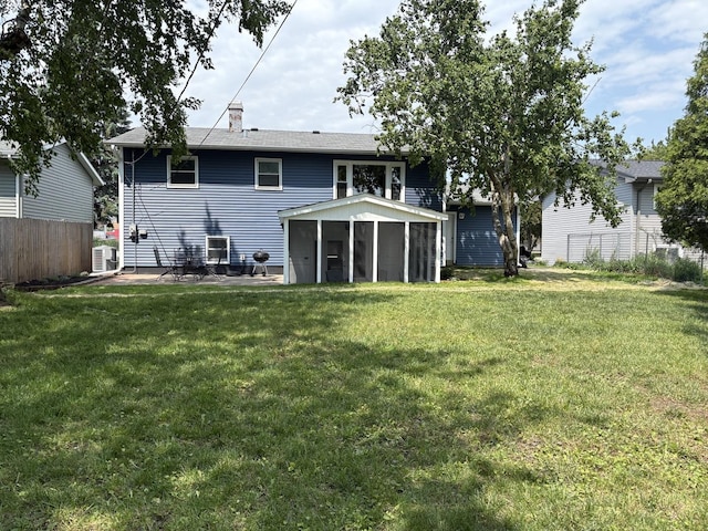 535 N Midlothian Rd, Mundelein, IL 60060 - back of property with a sunroom and a chimney