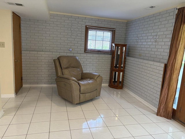 535 N Midlothian Rd, Mundelein, IL 60060 - sitting room featuring brick wall and light tile patterned flooring