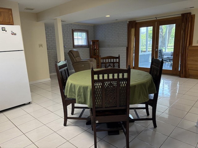 535 N Midlothian Rd, Mundelein, IL 60060 - dining area with brick wall, light tile patterned floors, and french doors