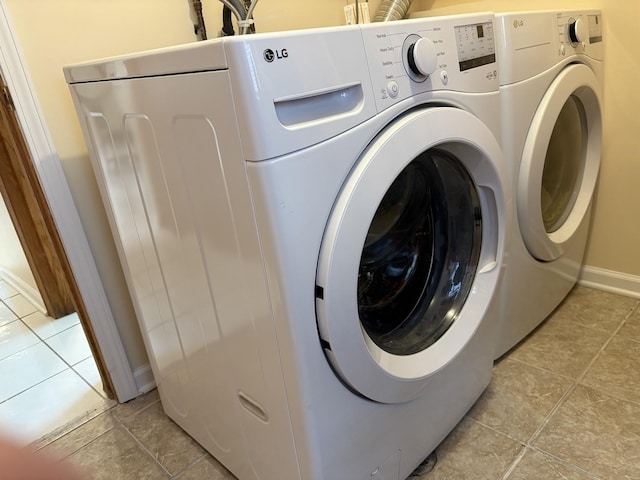 535 N Midlothian Rd, Mundelein, IL 60060 - laundry area featuring washer and dryer and light tile patterned floors