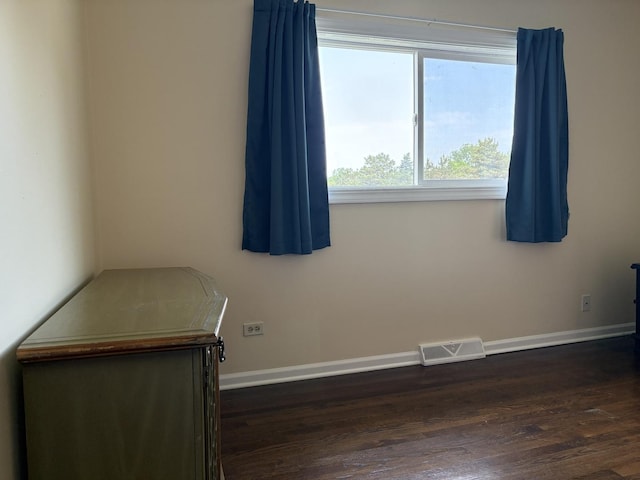 535 N Midlothian Rd, Mundelein, IL 60060 - spare room with baseboards and dark wood finished floors