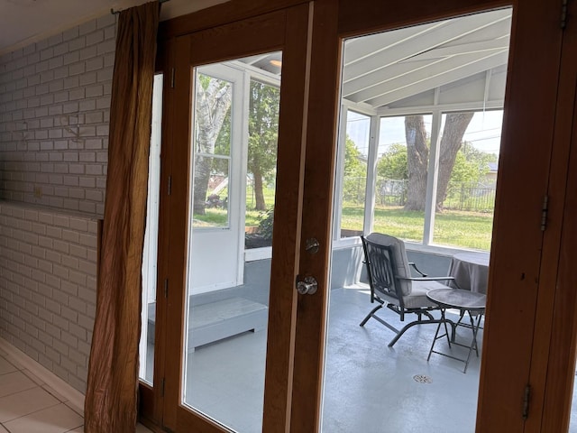 535 N Midlothian Rd, Mundelein, IL 60060 - doorway featuring vaulted ceiling and concrete floors