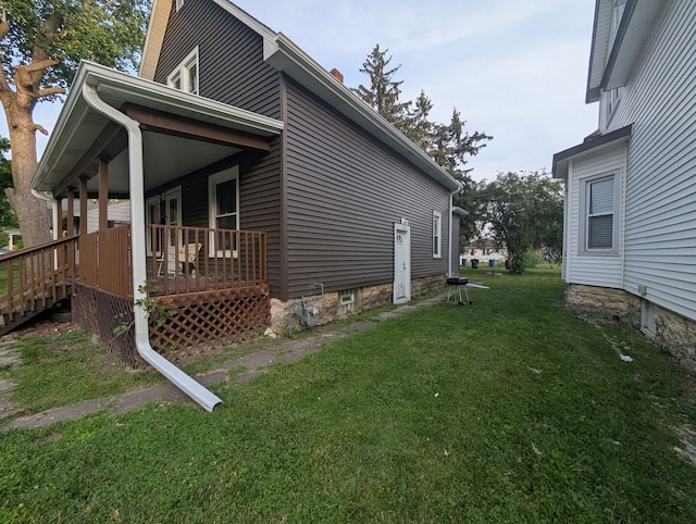 1350 E Chestnut St, Kankakee, IL 60901 - view of side of home featuring a lawn and covered porch