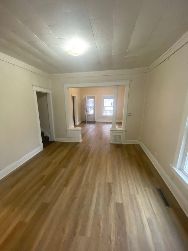 1350 E Chestnut St, Kankakee, IL 60901 - empty room featuring wood finished floors and crown molding