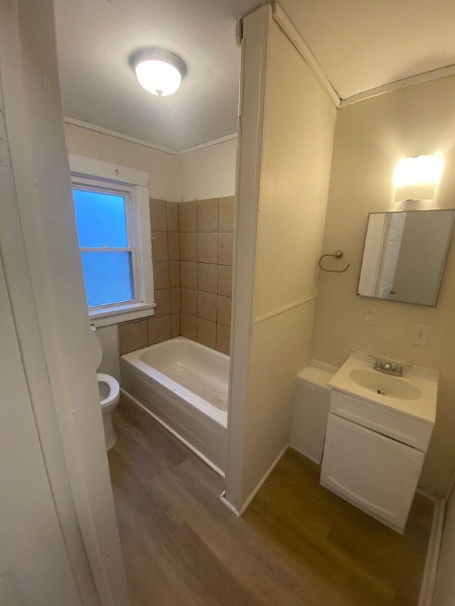 1350 E Chestnut St, Kankakee, IL 60901 - full bath featuring wood finished floors, a tub, vanity, and ornamental molding