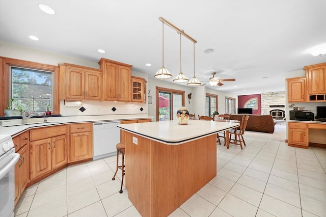 15501 116th Ct, Orland Park, IL 60467 - kitchen featuring dishwasher, range, a center island, a ceiling fan, and light tile patterned floors