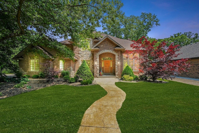 15501 116th Ct, Orland Park, IL 60467 - traditional-style home with a front yard, brick siding, and a shingled roof