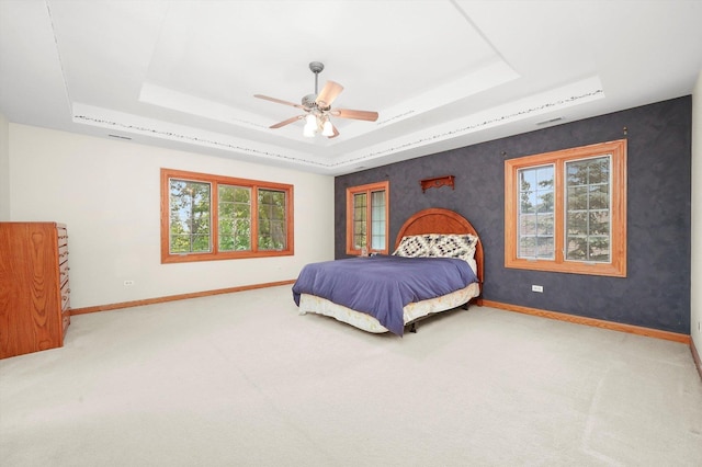 15501 116th Ct, Orland Park, IL 60467 - carpeted bedroom featuring a raised ceiling and a ceiling fan