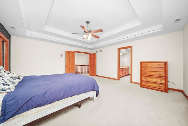 15501 116th Ct, Orland Park, IL 60467 - bedroom featuring a raised ceiling, light colored carpet, and a ceiling fan