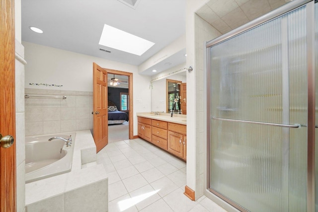 15501 116th Ct, Orland Park, IL 60467 - full bathroom featuring a skylight, a bath, a stall shower, and double vanity