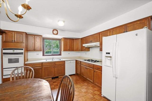 1554 Chickasaw Dr, Naperville, IL 60563 - kitchen featuring white appliances, under cabinet range hood, a warming drawer, light countertops, and brown cabinetry