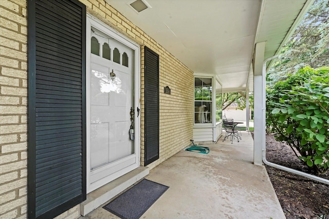 1554 Chickasaw Dr, Naperville, IL 60563 - doorway to property featuring brick siding and covered porch