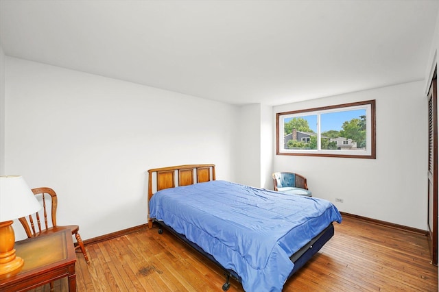 1554 Chickasaw Dr, Naperville, IL 60563 - bedroom with light wood-style flooring and baseboards