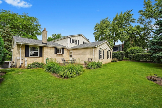 1554 Chickasaw Dr, Naperville, IL 60563 - rear view of property with a chimney, brick siding, roof with shingles, and a patio area