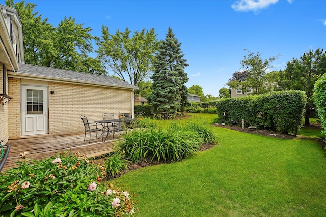 1554 Chickasaw Dr, Naperville, IL 60563 - view of green lawn featuring a wooden deck and outdoor dining area