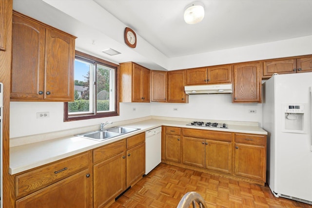 1554 Chickasaw Dr, Naperville, IL 60563 - kitchen with white appliances, under cabinet range hood, light countertops, and brown cabinets
