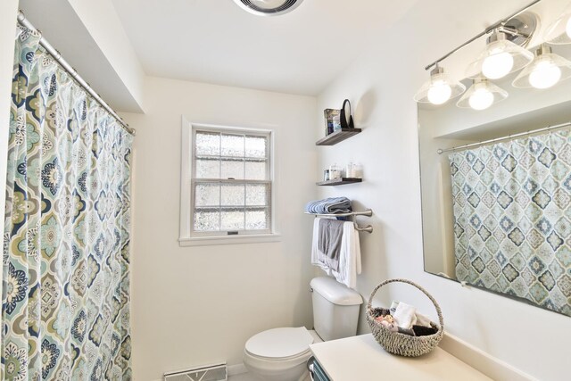 109 E Seminole St, Dwight, IL 60420 - full bath featuring vanity, a baseboard heating unit, and a shower with curtain