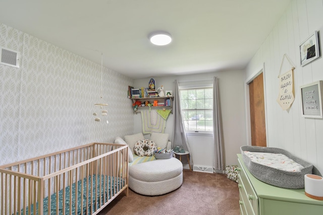 109 E Seminole St, Dwight, IL 60420 - bedroom with a nursery area, carpet, and wallpapered walls