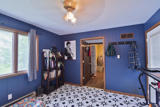 109 E Seminole St, Dwight, IL 60420 - bedroom with multiple windows, light flooring, baseboard heating, and ceiling fan