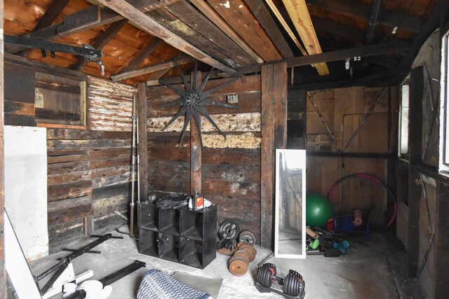 109 E Seminole St, Dwight, IL 60420 - miscellaneous room with wood walls, concrete flooring, and vaulted ceiling