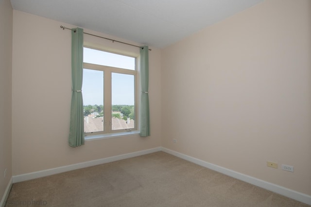 8440 Callie Ave Unit 410, Morton Grove, IL 60053 - unfurnished room featuring light colored carpet and baseboards