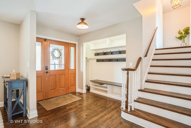 6140 Ruby St, Rosemont, IL 60018 - entryway with dark wood-style flooring and stairway