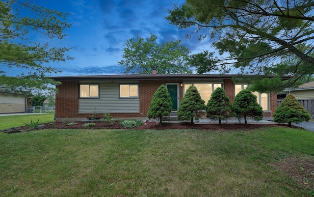 320 Pleasant St, Hoffman Estates, IL 60169 - view of front of home with brick siding, entry steps, and a chimney