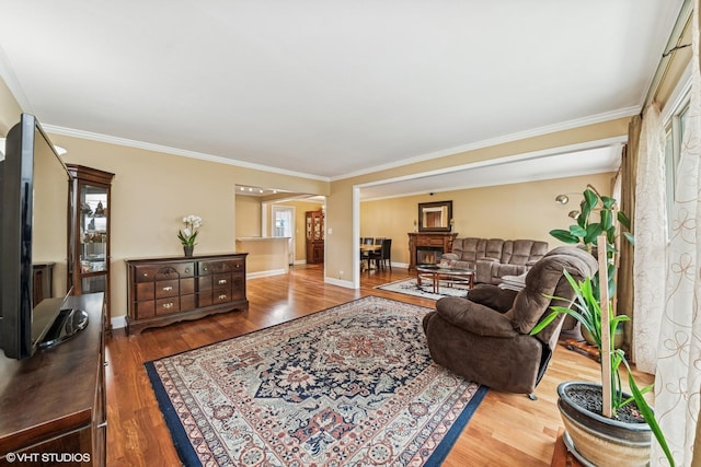 320 Pleasant St, Hoffman Estates, IL 60169 - living area featuring wood finished floors, ornamental molding, and arched walkways