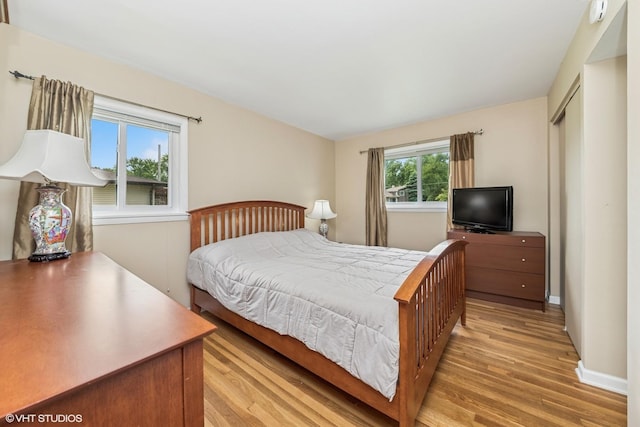 320 Pleasant St, Hoffman Estates, IL 60169 - bedroom with light wood-type flooring and baseboards