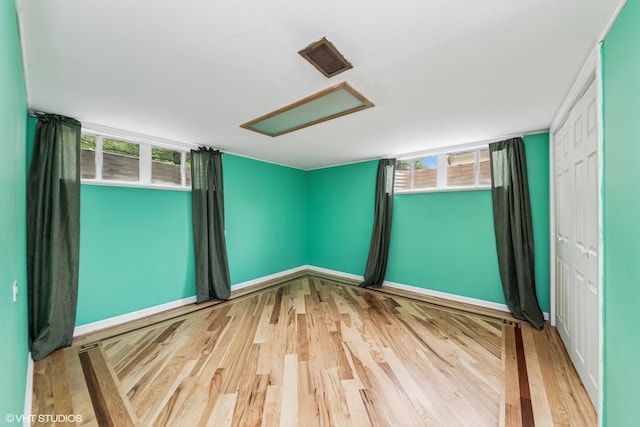320 Pleasant St, Hoffman Estates, IL 60169 - unfurnished room featuring wood finished floors and attic access