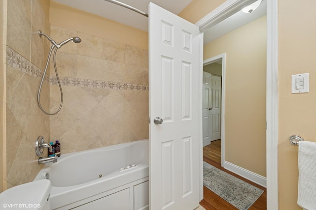 320 Pleasant St, Hoffman Estates, IL 60169 - bathroom with wood finished floors and a combined bath / shower with jetted tub