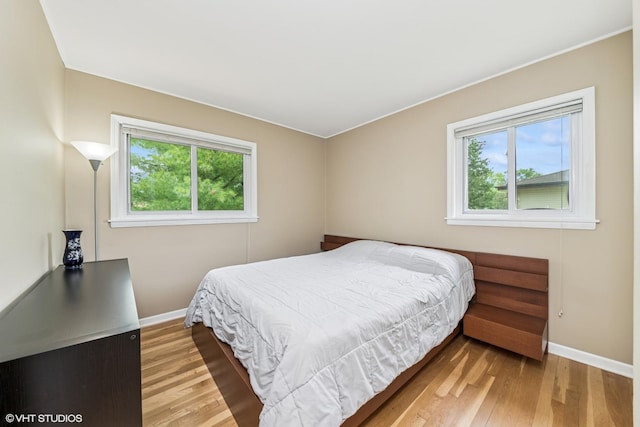 320 Pleasant St, Hoffman Estates, IL 60169 - bedroom with baseboards and wood finished floors