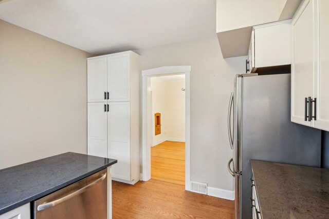 237 Le Grande Blvd, Aurora, IL 60506 - kitchen featuring light wood-style floors, stainless steel appliances, and white cabinetry