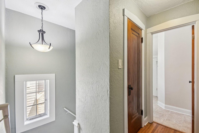 237 Le Grande Blvd, Aurora, IL 60506 - corridor with light wood-type flooring and a textured wall