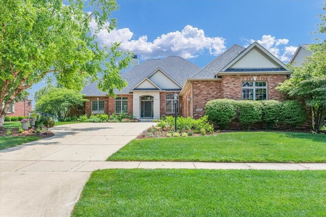 4905 Peifer Ln, Champaign, IL 61822 - living area featuring arched walkways, light carpet, coffered ceiling, ornamental molding, and beam ceiling