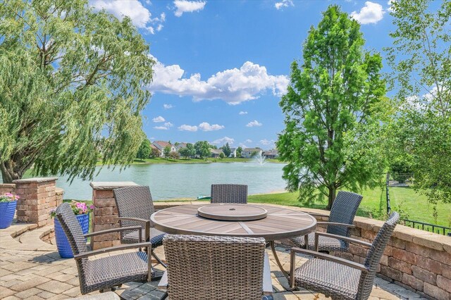 4905 Peifer Ln, Champaign, IL 61822 - view of patio featuring a water view and outdoor dining space