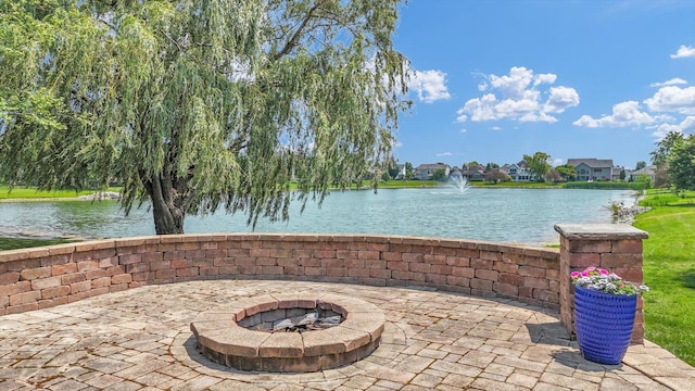 4905 Peifer Ln, Champaign, IL 61822 - view of patio / terrace featuring an outdoor fire pit and a water view