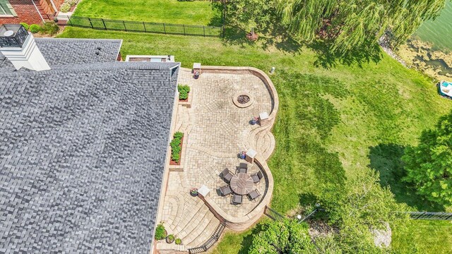 4905 Peifer Ln, Champaign, IL 61822 - back of property with brick siding, roof with shingles, a chimney, a ceiling fan, and area for grilling